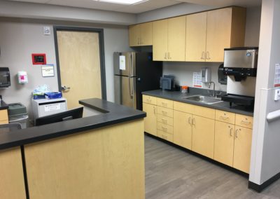 Hospital nurses desk with cabinets installed and designed by MAC in Kansas City