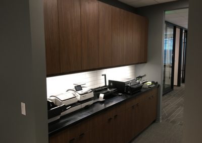 Dark wood office cabinets created and designed by MAC in Kansas City