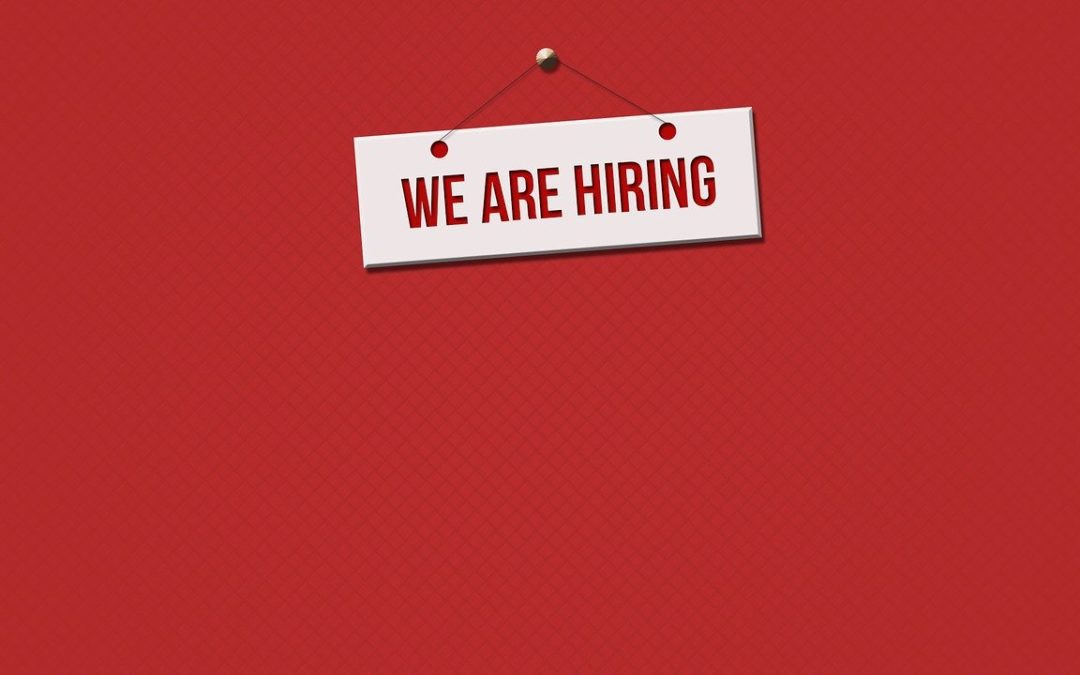 We Are Hiring sign on a red background