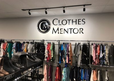 Clothes Mentor building and logo with clothes racks