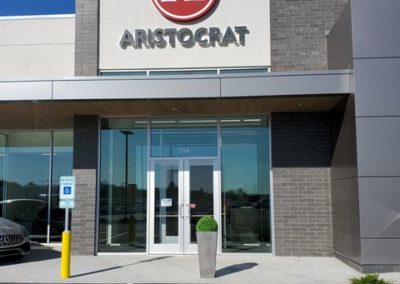 Entrance to Aristocrat with glass doors designed by MAC