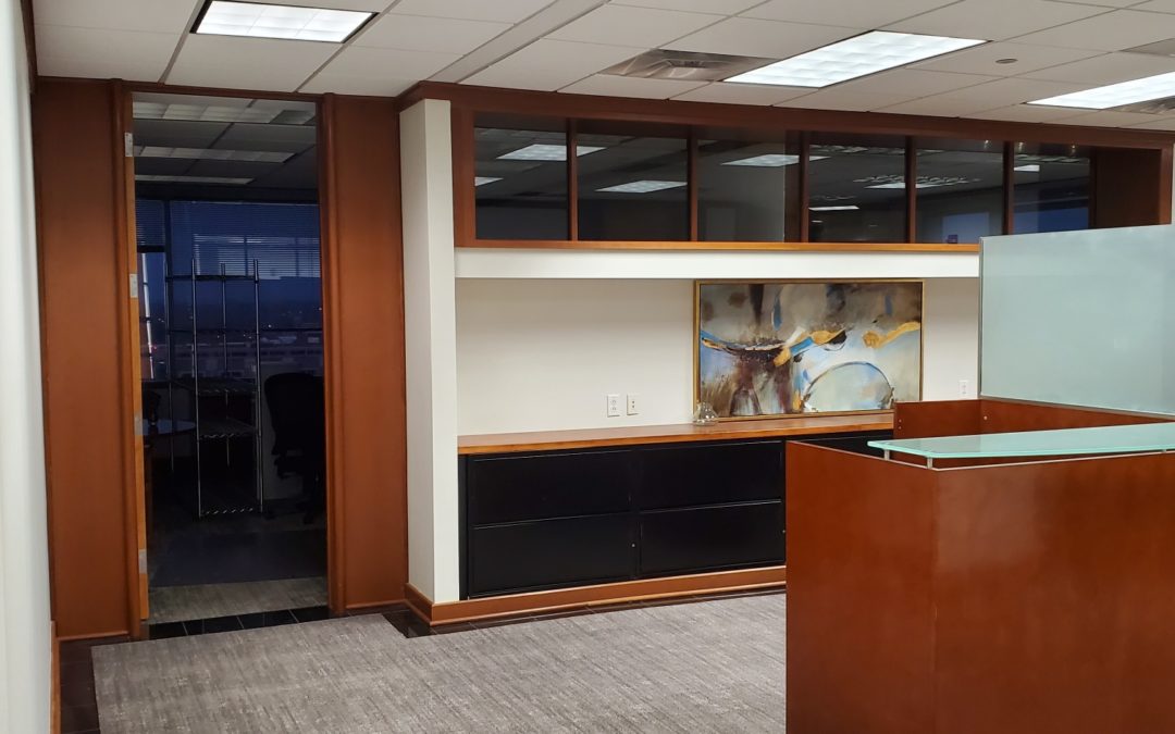Cabinets with built in glass created and installed by MAC in an office space