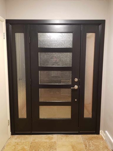 Dark wood door with frosted glass accents