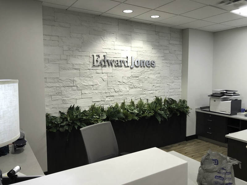 Entrance to Edward Jones with custom stone siding in a modern office design by MAC in Kansas City
